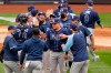 Tampa Bay Rays players congratulate designated hitter Yoshi Tsutsugo, center, who drove in the go-ahead run during the seventh inning of a baseball game against the New York Yankees, Sunday, April 18, 2021, at Yankee Stadium in New York. (AP Photo/Kathy Willens)