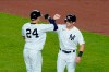 New York Yankees' Gary Sanchez, left, celebrates with teammate Mike Tauchman after they scored on a two-run home run by Sanchez during the fifth inning of a baseball game against the Boston Red Sox Friday, Aug. 14, 2020, in New York. (AP Photo/Frank Franklin II)