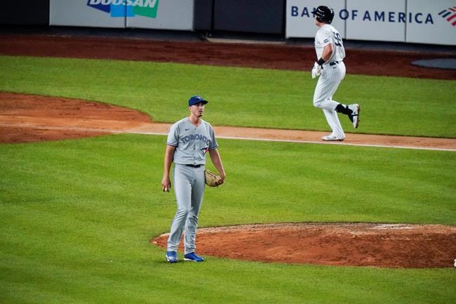 Toronto Blue Jays pitcher Jacob Waguespack reacts as New York Yankees' Luke Voit , right, after hitting a three-run home run during the sixth inning of a baseball game Wednesday, Sept. 16, 2020, in New York. (AP Photo/Frank Franklin II)