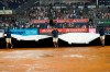 The grounds crew roll out the tarp during a rain delay after sixth inning of a baseball game between the New York Yankees and the Boston Red Sox, Saturday, July 17, 2021, in New York. (AP Photo/Mary Altaffer)