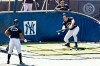 New York Yankees Aaron Hicks, left, and Luke Voit, above right, watch as Aaron Judge begins his batting practice with a bunt at Yankees summer baseball training camp, Wednesday, July 15, 2020, at Yankee Stadium in New York. (AP Photo/Kathy Willens)