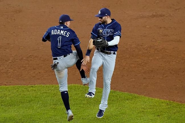 Tampa Bay Rays shortstop Willy Adames (1) and center fielder Kevin Kiermaier celebrate after the Rays defeated the New York Yankees 5-2 in a baseball game, Wednesday, Sept. 2, 2020, at Yankee Stadium in New York. (AP Photo/Kathy Willens)