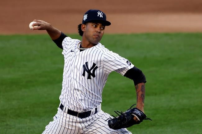 New York Yankees pitcher Deivi García delivers against the New York Mets during the third inning of the second baseball game of a doubleheader, Sunday, Aug. 30, 2020, in New York. (AP Photo/Adam Hunger)