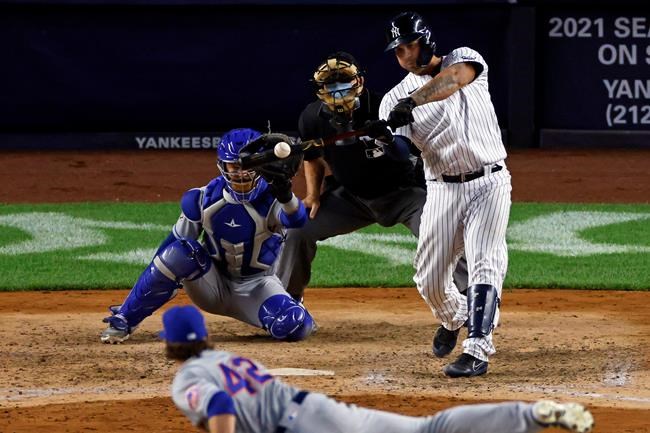 New York Yankees' Gary Sanchez hits a grand slam off of New York Mets pitcher Drew Smith during the eighth inning of the second baseball game of a doubleheader, Sunday, Aug. 30, 2020, in New York. (AP Photo/Adam Hunger)