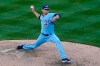 Toronto Blue Jays relief pitcher Julian Merryweather winds up during the 10th inning of a baseball game against the New York Yankees on opening day at Yankee Stadium, Thursday, April 1, 2021, in New York. (AP Photo/Kathy Willens)