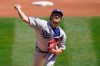 Los Angeles Dodgers pitcher Trevor Bauer throws against the Oakland Athletics during the first inning of a baseball game in Oakland, Calif., Wednesday, April 7, 2021. (AP Photo/Jeff Chiu)