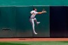 Detroit Tigers center fielder Victor Reyes cannot catch a run-scoring triple hit by Oakland Athletics' Ramon Laureano during the fourth inning of a baseball game in Oakland, Calif., Sunday, April 18, 2021. (AP Photo/Jeff Chiu)