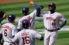 CORRECTS TO ALSO SCORED ALEDMYS DIAZ (16) NOT YULI GURRIEL - Houston Astros‚Äô Yordan Alvarez (44) celebrates with Yuli Gurriel, center, after hitting a three-run home run that also scored Chas McCormick (6) and Aledmys Diaz (16) during the fifth inning of a baseball game against the Oakland Athletics in Oakland, Calif., Saturday, April 3, 2021. (AP Photo/Jeff Chiu)