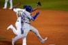 Oakland Athletics pitcher Reymin Guduan (61) makes contact with Los Angeles Dodgers' Cody Bellinger on Bellinger's single during the ninth inning of a baseball game in Oakland, Calif., Monday, April 5, 2021. Guduan and Bellinger both left the game after the play. (AP Photo/Jeff Chiu)