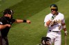 Home plate umpire Adam Hamari, left, gestures after Oakland Athletics' Ramon Laureano, right, struck out against Chicago White Sox pitcher Lucas Giolito during the sixth inning of Game 1 of an American League wild-card baseball series Tuesday, Sept. 29, 2020, in Oakland, Calif. (AP Photo/Eric Risberg)