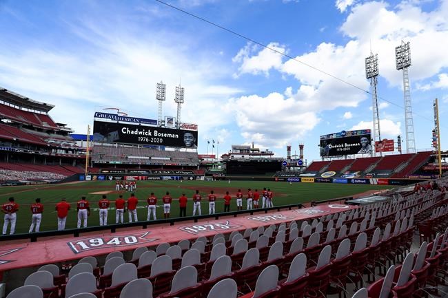 Videoboards pay tribute to Chadwick Boseman prior to a baseball game between the Chicago Cubs and the Cincinnati Reds in Cincinnati, Saturday, Aug. 29, 2020. (AP Photo/Aaron Doster)