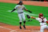 Pittsburgh Pirates' Josh Bell (55) reacts to drawing a walk as Cincinnati Reds' Tucker Barnhart (16) reacts in the first inning during a baseball game at in Cincinnati, Friday, Aug. 14, 2020. (AP Photo/Aaron Doster)