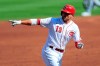 Cincinnati Reds' Joey Votto (19) points to members of the grounds crew after he hit a solo home run in the first inning during a baseball game against the Detroit Tigers at Great American Ballpark in Cincinnati, Saturday, July 25, 2020. (AP Photo/Aaron Doster)