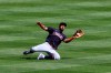 Cleveland Indians' Eddie Rosario makes a catch for an out during the fifth inning of a baseball game in Cincinnati, Sunday, April 18, 2021. (AP Photo/Aaron Doster)