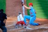 Cincinnati Reds' Nick Castellanos, center, scores a run ahead of the tag by St. Louis Cardinals' Jake Woodford, right, during the fourth inning of a baseball game in Cincinnati, Saturday, April 3, 2021. (AP Photo/Aaron Doster)