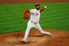 Cincinnati Reds' Amir Garrett throws during the ninth inning of a baseball game against the Pittsburgh Pirates in Cincinnati, Monday, April 5, 2021. (AP Photo/Aaron Doster)