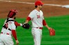 Cincinnati Reds' Tucker Barnhart, left, fist-bumps Tyler Mahle, right, as he leaves a baseball game in the sixth inning against the Chicago White Sox in Cincinnati, Friday, Sept. 18, 2020. (AP Photo/Aaron Doster)