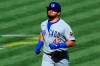 Chicago Cubs' Kyle Schwarber reacts after hitting a grand slam in the ninth inning during a baseball game against the Cincinnati Reds in Cincinnati, Sunday, Aug. 30, 2020. The Cubs won 10-1. (AP Photo/Aaron Doster)