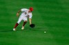 Cincinnati Reds' Nick Senzel (15) fields the ball hit for a single by Pittsburgh Pirates' Cole Tucker (3) in the fifth inning during a baseball game at in Cincinnati, Friday, Aug. 14, 2020. The Reds won 8-1. (AP Photo/Aaron Doster)