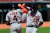 Detroit Tigers' C.J. Cron (26) celebrates with Cameron Maybin (4) after hitting a two-run home run in the ninth inning during a baseball game against the Detroit Tigers at Great American Ballpark in Cincinnati, Sunday, July 26, 2020. (AP Photo/Aaron Doster)