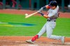 St. Louis Cardinals Tommy Edman hits an RBI double during the third inning of the team's baseball game against the Cincinnati Reds in Cincinnati, Tuesday, Sept. 1, 2020. (AP Photo/Bryan Woolston)