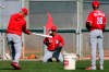 Cincinnati Reds special assistant Mario Soto, left, hits a baseball to Cincinnati Reds starting pitcher Luis Castillo (58) during drills, Monday, Feb. 17, 2020, at the baseball team's spring training facility in Goodyear, Ariz. (Kareem Elgazzar/The Cincinnati Enquirer via AP)