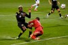 Columbus Crew forward Gyasi Zardes (11) collides with Monterrey goalkeeper Luis Cárdenas (22) in the first half of the CONCACAF Champions League soccer match at Crew Stadium in Columbus, Ohio, Wednesday, April 28, 2021. (Adam Cairns/The Columbus Dispatch via AP)