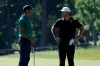 Tiger Woods, left, talks with Brooks Koepka on the 11th fairway during the third round of the Memorial golf tournament, Saturday, July 18, 2020, in Dublin, Ohio. (AP Photo/Darron Cummings)