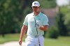 Bryson DeChambeau walks from the bunker in the practice area during a practice round for the Memorial golf tournament, Wednesday, July 15, 2020, in Dublin, Ohio. (AP Photo/Darron Cummings)