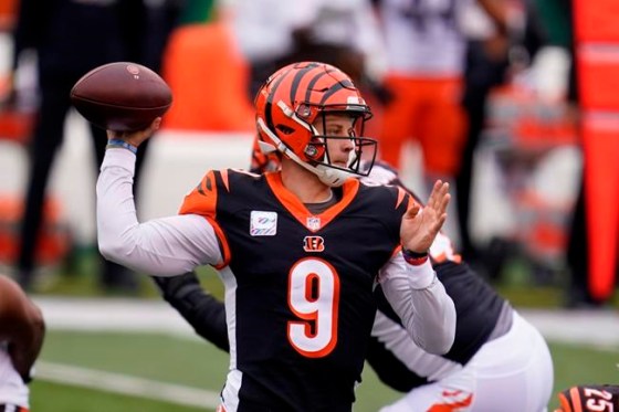Cincinnati Bengals quarterback Joe Burrow (9) throws during the first half of an NFL football game against the Cleveland Browns, Sunday, Oct. 25, 2020, in Cincinnati. (AP Photo/Michael Conroy)