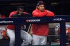 Cleveland Indians' Josh Naylor, right, and Franmil Reyes watch from the dugout after the Indians lost 10-9 to the New York Yankees in Game 2 of an American League wild-card baseball series, early Thursday, Oct. 1, 2020, in Cleveland. (AP Photo/David Dermer)