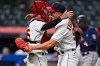 Cleveland Indians' relief pitcher James Karinchak (99) is congratulated by catcher Roberto Perez after the Indians defeated the Minnesota Twins in a baseball game, Tuesday, April 27, 2021, in Cleveland. (AP Photo/David Dermer)
