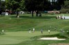 A group putts on the 17th green, below, during the first round of the LPGA Drive On Championship golf tournament at Inverness Golf Club in Toledo, Ohio, Friday, July 31, 2020. The tournament is being played with no fans due to COVID-19 safety protocol. (AP Photo/Gene J. Puskar)