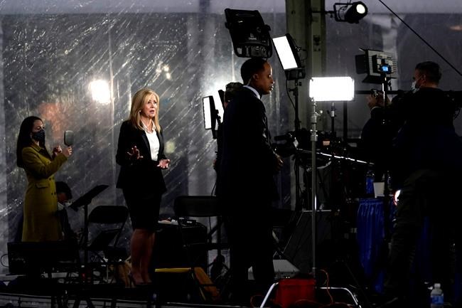 Broadcast journalists stand in front of cameras outside the Health Education Campus of Case Western Reserve University ahead of the first presidential debate between Republican candidate President Donald Trump and Democratic candidate former Vice President Joe Biden, Tuesday, Sept. 29, 2020, in Cleveland. (AP Photo/Julio Cortez)