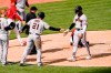 Arizona Diamondbacks' Nick Heath (9) celebrates with Stephen Vogt (21) after scoring a run in the 10th inning of a baseball game against the Cincinnati Reds in Cincinnati, Thursday, April 22, 2021. (AP Photo/Jeff Dean)