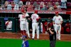 Cincinnati Reds' Joey Votto (19) is congratulated by Jesse Winker (33) after hitting a two-run home run, his 300th career home run, in the third inning of the team's baseball game against the Chicago Cubs in Cincinnati on Friday, April 30, 2021. (AP Photo/Jeff Dean)