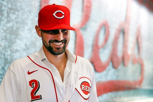 Cincinnati Reds' Nick Castellanos waits for interviews to begin during a news conference announcing his signing with the baseball club, Tuesday, Jan. 28, 2020, in Cincinnati. Castellanos signed a $64 million, four-year deal with the Reds. (AP Photo/John Minchillo)