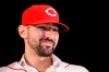 Cincinnati Reds' Nick Castellanos wears his cap during a news conference, Tuesday, Jan. 28, 2020, in Cincinnati. Castellanos signed a $64 million, four-year deal with the baseball club. (AP Photo/John Minchillo)