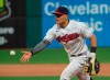 Cleveland Indians' Yu Chang tosses the ball to pitcher Aaron Civale to get Detroit Tigers' Akil Baddoo out at first base during the fifth inning of a baseball game in Cleveland, Saturday, April 10, 2021. (AP Photo/Phil Long)