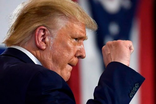 President Donald Trump pumps his fist as he finishes speaking during an event at the Whirlpool Corporation facility in Clyde, Ohio, Thursday, Aug. 6, 2020. (AP Photo/Susan Walsh)
