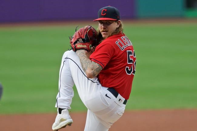 Cleveland Indians starting pitcher Mike Clevinger delivers in the first inning in a baseball game against the Minnesota Twins, Wednesday, Aug. 26, 2020, in Cleveland. (AP Photo/Tony Dejak)