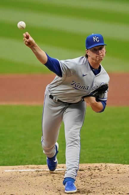 Kansas City Royals starting pitcher Brady Singer delivers in the first inning of the team's baseball game against the Cleveland Indians, Thursday, Sept. 10, 2020, in Cleveland. (AP Photo/Tony Dejak)