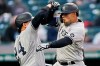 New York Yankees' Rougned Odor, right, and Gary Sanchez celebrate after Odor hit a two-run home run in the second inning of a baseball game against the Cleveland Indians, Friday, April 23, 2021, in Cleveland. Sanchez also scored on the play. (AP Photo/Tony Dejak)
