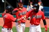From left to right, Cleveland Indians' Jose Ramirez is congratulated by Yu Chang and Cesar Hernandez after hitting a three-run home run in the fourth inning in a baseball game against the Kansas City Royals, Sunday, July 26, 2020, in Cleveland. (AP Photo/Tony Dejak)