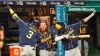 Milwaukee Brewers' Orlando Arcia, left, and Luis Urias celebrate after Arcia hit a solo home run in the eighth inning in a baseball game against the Cleveland Indians, Saturday, Sept. 5, 2020, in Cleveland. (AP Photo/Tony Dejak)
