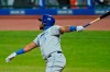 Kansas City Royals' Maikel Franco watches his RBI sacrifice fly during the eighth inning of the team's baseball game against the Cleveland Indians, Tuesday, Sept. 8, 2020, in Cleveland. (AP Photo/Tony Dejak)