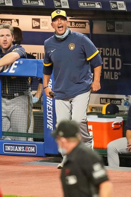 Milwaukee Brewers hitting coach Andy Haines argues a call with home plate umpire Jerry Meals after getting ejected in the seventh inning in a baseball game against the Cleveland Indians, Friday, Sept. 4, 2020, in Cleveland. (AP Photo/Tony Dejak)