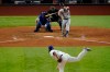 Houston Astros' Alex Bregman hits a double off Texas Rangers starting pitcher Lance Lynn during the sixth inning of a baseball game in Arlington, Texas, Thursday, Sept. 24, 2020. (AP Photo/Tony Gutierrez)