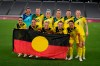 Australia players pose for a group photo with an indigenous flag prior to women's soccer match against New Zealand at the 2020 Summer Olympics, Wednesday, July 21, 2021, in Tokyo. (AP Photo/Ricardo Mazalan)