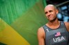 FILE - In this Aug. 8, 2016, file photo, Jake Gibb, of the United States, waits to be introduced to the crowd for a men's beach volleyball match against Austria at the Summer Olympics in Rio de Janeiro, Brazil. American beach volleyball player Taylor Crabb is out of the Olympics after several positive COVID-19 tests, and Tri Bourne will take his place as the partner of four-time Olympian Gibb when the competition begins at Tokyo’s Shiokaze Park this weekend. (AP Photo/David Goldman, File)
